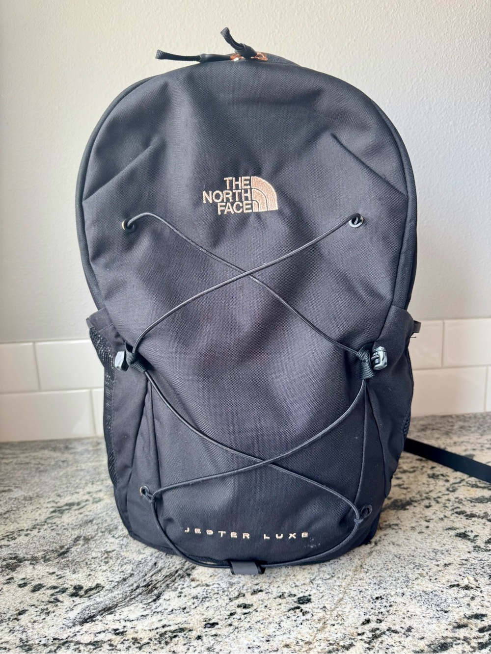 The North Face Jester Luxe in Black w/ Rose Gold. VGUC. PLEASE READ